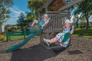 Playground with Fort, Slide and Swings