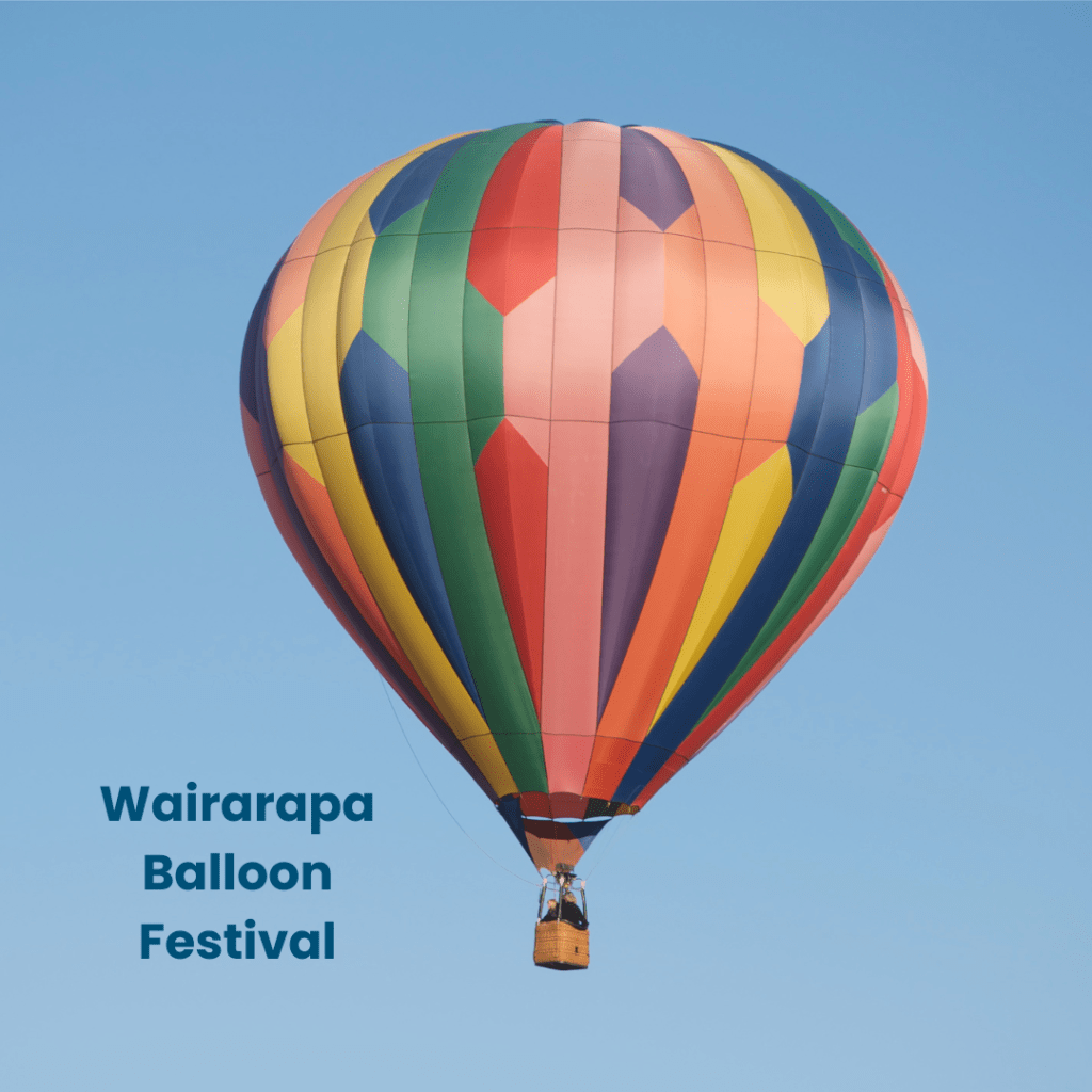 Image of a colourful hot air balloon against a blue sky with the words Wairarapa Balloon Festival